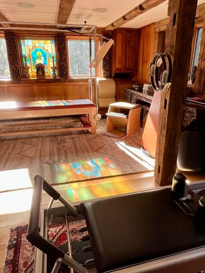 Sunlit classical Pilates home studio in Holliston, Massachusetts